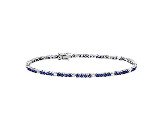 Everything you need to bring dazzling color to your look is here on this 14k white gold bracelet featuring quadruplets of sapphires interrupted by brilliant white diamonds.