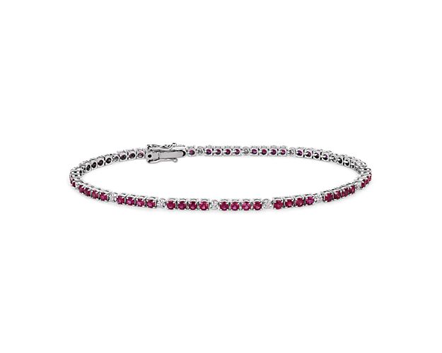 Everything you need to bring dazzling color to your look is here on this 14k white gold bracelet featuring quadruplets of rubies interrupted by brilliant white diamonds.