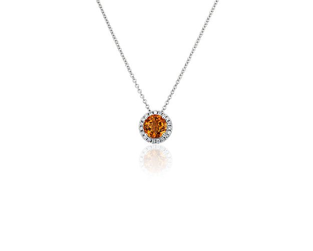 Capture your ray of starlight when layering on this striking 14k white gold pendant necklace. Its perfectly round citrine baths in the light of a white diamond halo creating a beautiful interplay of sparkle and color.