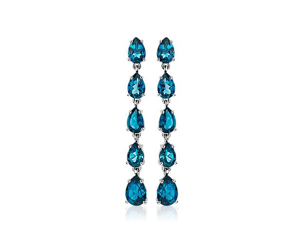 Crafted in sterling silver, these drop earrings showcase stunning pear-shaped London Blue Topaz stones. Day or night, these earrings will complete any outfit.