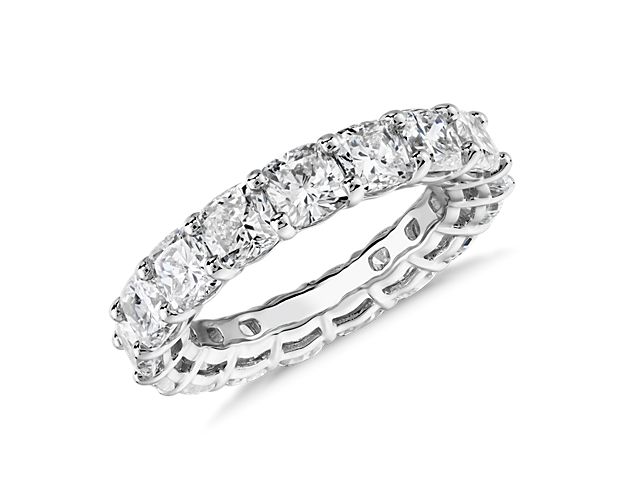 An unbroken circle of dazzling cushion-cut diamonds enlivens every angle of this 6 ct. tw. eternity ring set in enduring platinum.