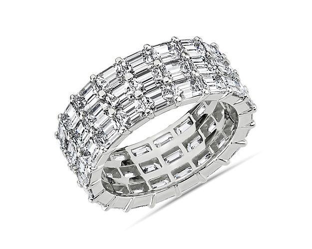 Three rows of east-west emerald cut diamonds give this platinum eternity band show-stopping shimmer from all angles.