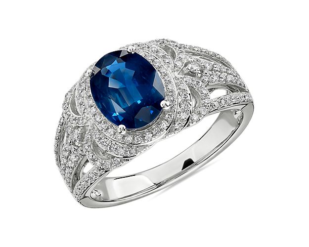 A classic but stylish choice, this elegant sapphire gemstone ring is surrounded by pavé-set diamonds framed in 14k white gold.