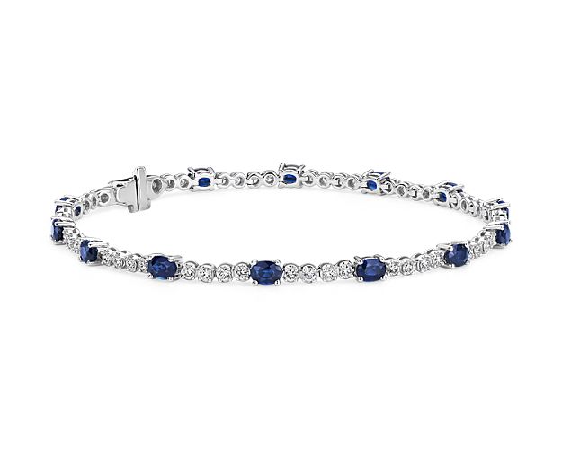 This sapphire and diamond bracelet combines classic tennis bracelet style with a colorful blue hue. Deep blue oval-cut sapphires alternate with round-brilliant cut diamonds in an alternating pattern that adds eye-catching interest to this jewelry box essential.