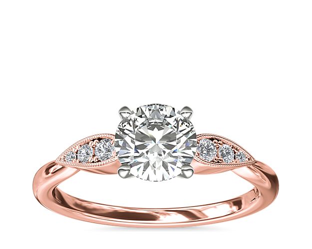 Celebrate love with romantic style. This beautiful design in 14k rose gold features delicate pear-shaped details set with three petite diamonds flanking each side of your center stone.