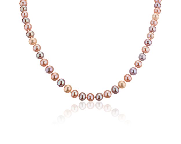 A strand of freshwater cultured pearls in varying hues of pink offers a fresh take on a classic style. Nearly round multicolor pearls are strung on a hand-knotted silk blend cord and completed with a sterling silver heart-shaped clasp.