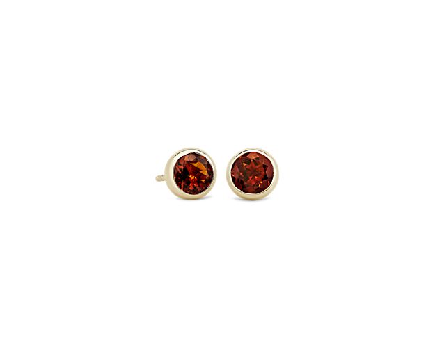 Rethink your ear stack by anchoring your look with colorful citrine stud earrings bezel set in 14k yellow gold.