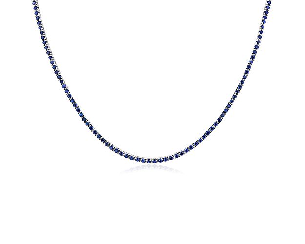 Brilliant blue sapphires glitter endlessly along this classic eternity necklace featuring a 16.5'' length. It features richly lustrous 14k white gold design for lasting quality.