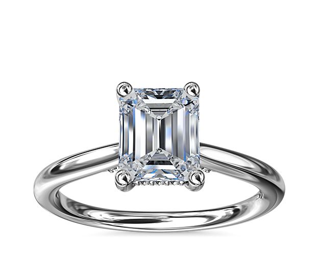 Classic from a bird's-eye view, this 14k white gold solitaire has a delicate diamond profile and slight cathedral that put your center stone on display.