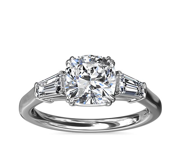 A timeless symbol of love and beauty, this platinum engagement ring marries Art Deco-inspired style with pure elegance as twin tapered baguette diamonds frame a center stone casting their everlasting light in every direction.