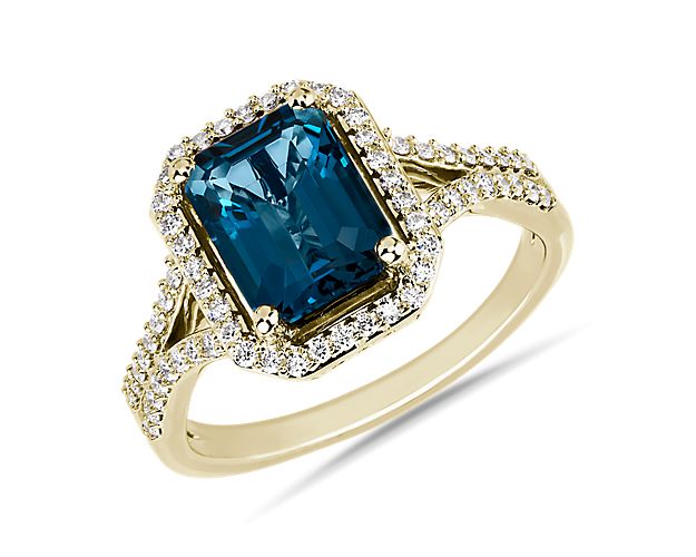 Draw their attention with this breathtaking ring set with a London blue topaz that boasts a mesmerizing blue hue. A sparkling diamond diamond  lustrous warmth of the yellow gold setting beautifully complements the stone.