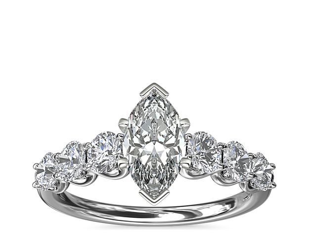 A timeless symbol of love, this Selene engagement ring features a luminous platinum setting lined with six round accent diamonds to create a stunning U-shaped profile that complements your center stone.
