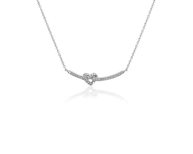Express your love with this elegant and sparkling 14k white gold bar necklace featuring an unexpected heart-shaped knot at its center.