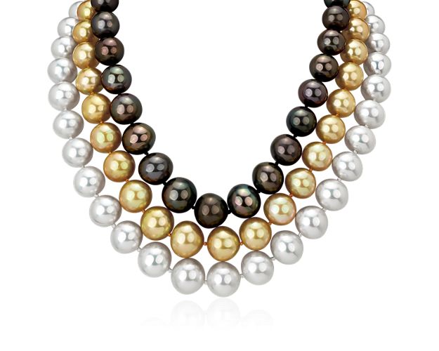 Made to be stacked together with its diamond clasp or worn as single statement strands, this necklace comprised of gold, white and gray pearl strands in one that can't help but stand out.