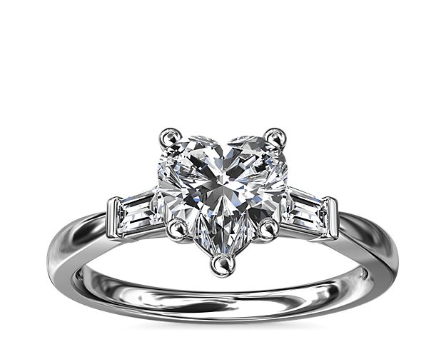 Classic and timeless, this engagement ring features two dazzling tapered baguettes that frame your choice of center stone beautifully.