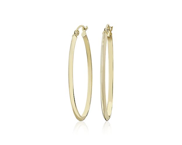 Featuring sweeping silhouettes of slender 14k yellow gold, these oval-shaped hoops bring a graceful touch to your look.
