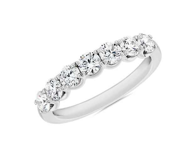 Seven brilliant diamonds sparkle from this breathtaking anniversary band, symbolizing eternal love. A 14k white gold design gives it a sophisticated, bright luster.