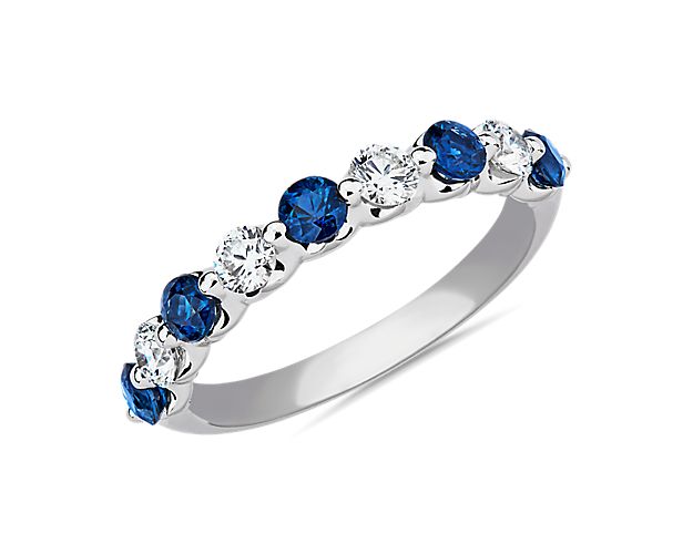 Sky blue sapphires and decadent diamonds dance along the 14k white gold band of this anniversary ring that features a floating setting for maximum sparkle.