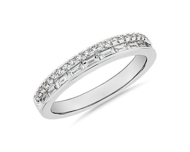 This seamless double row of baguette and round diamonds come together perfectly as one wedding band to accentuate your engagement ring. Great to stack with other rings or as a single statement piece for your special day! This designer piece also features the signature 14k yellow gold interior accent, authenticating this ring as ZAC Zac Posen.