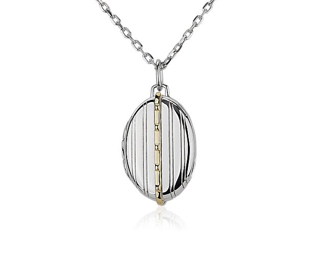 A band of rich 18k yellow gold imparts a touch of tonal beauty on this sleek, sterling silver locket featuring a textural pinstripe design.