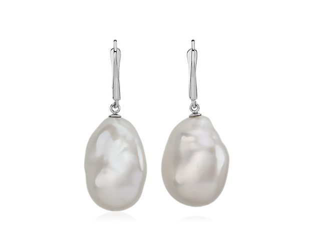Intricately crafted, these drop earrings showcase two baroque pearls for a unique and sophisticated look.  Due to the nature of the pearl, each earring set will vary slightly in shape.