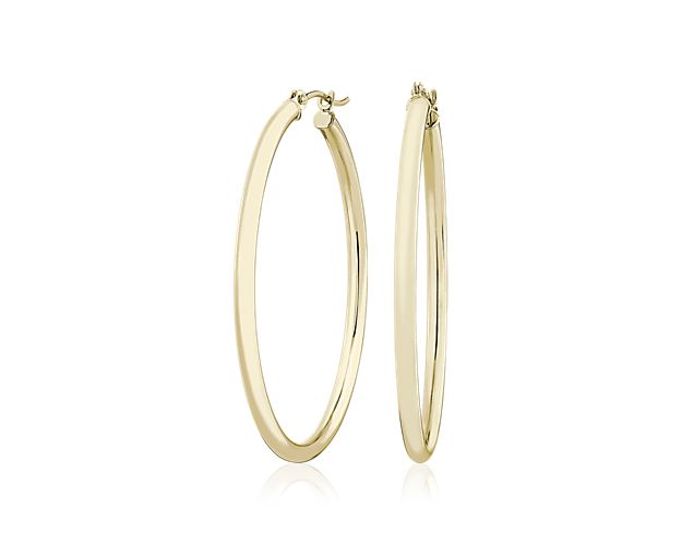 A style essential, these medium hoop earrings are crafted from 14k yellow gold tubing for a polished, lightweight look, finished with a snap back closure.