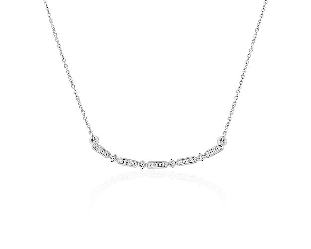 This eye-catching necklace features a stationary platinum design enlivened by detailing that will shimmer and shine.