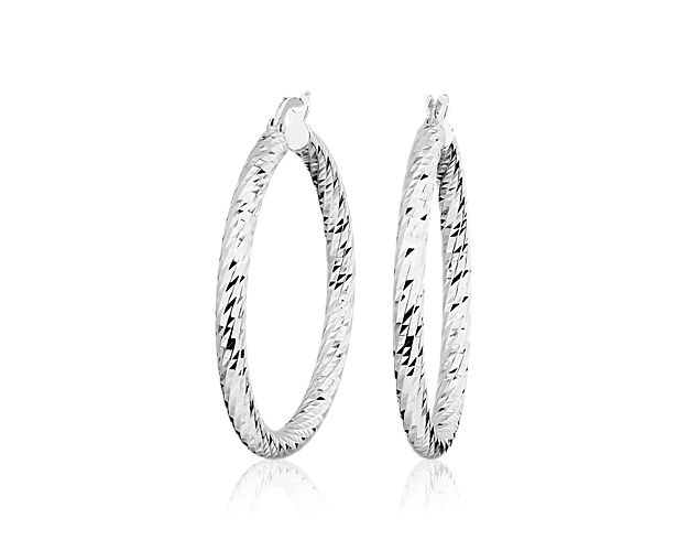 Crafted in 14k white gold, these hoop earrings are crafted to allow maximum shimmer and shine from every angle.