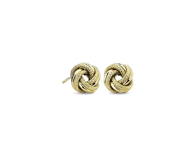 The classic love knot in 14k yellow gold is given a style upgrade with the addition of texture. These are the ultimate wear-everywhere earrings.