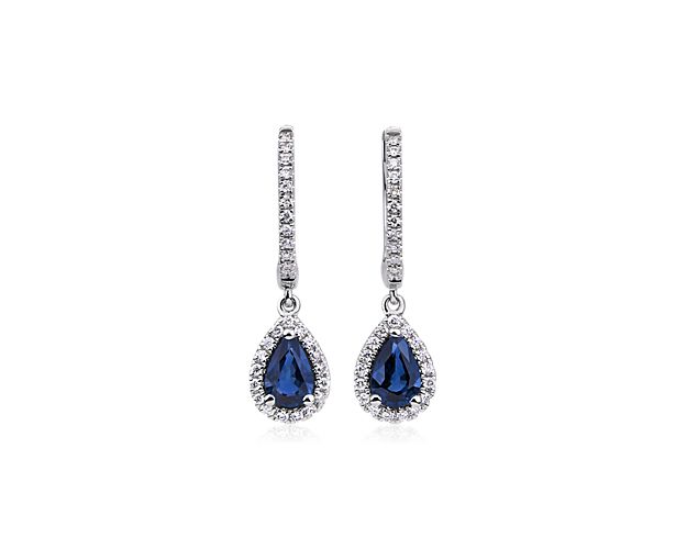 Luxurious pear-shaped sapphires sit nestled into a halo of diamonds in these droplet earrings. Made with 14k white gold, the shimmering hoops will add a dose of sparkle to your evening.