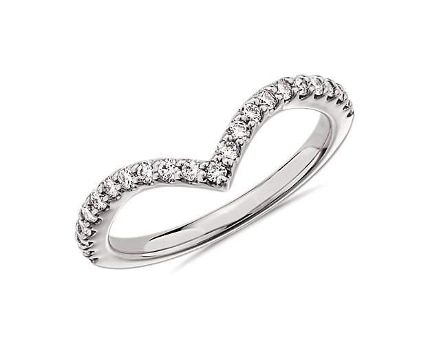 Whether nestled next to your engagement ring or stacked for a dazzling statement, this 14k white gold ring set with pavé diamonds on a slim v-shape band will forever be an enduring symbol of your love.