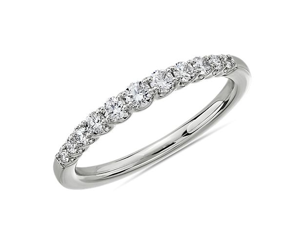 Make life's milestone moments sparkle with this dazzling platinum ring featuring a string of graduated stones that shine within their curved u-prong settings.