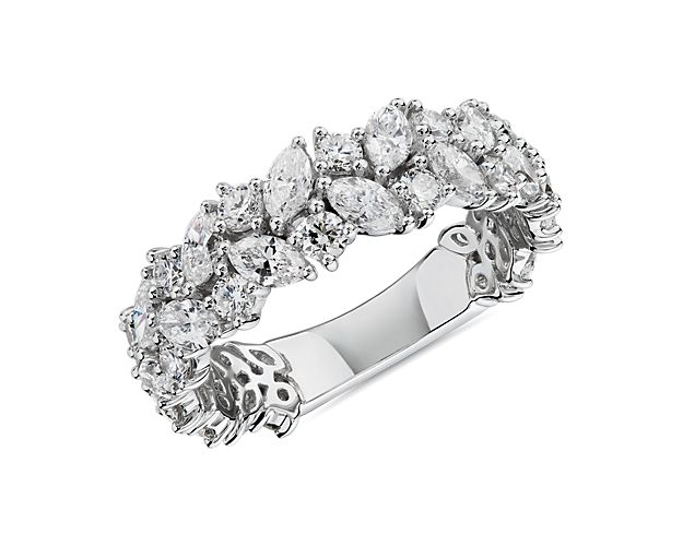 Commemorate love in breathtaking style with this wedding ring featuring 2 ct. tw. of marquise-cut and round-cut diamonds, arranged in beautiful clusters that catch the light. The intricate 14k white gold design beautifully complements the stones with its cool lustre.