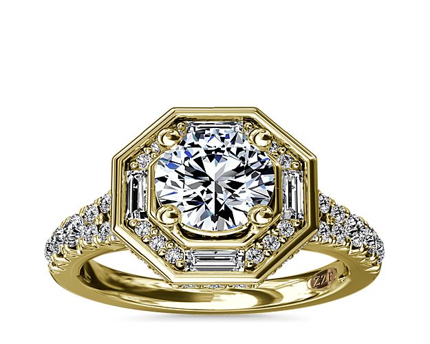 This stunning ZAC Zac Posen vintage-inspired diamond engagement ring features a unique hexagon halo adorned with baguette and round diamonds.  Not lacking in fine details, the sides of the halo and the profile of the ring feature even more diamonds so your ring sparkles from all angles.