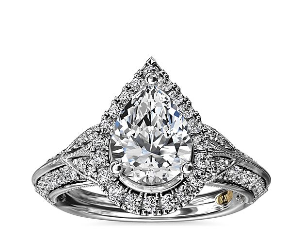Deco-inspired, this ZAC Zac Posen diamond engagement ring has a stunning halo to frame your pear-shaped diamond.  Milgrain detailing runs throughout, adding to the luxurious look of the style.