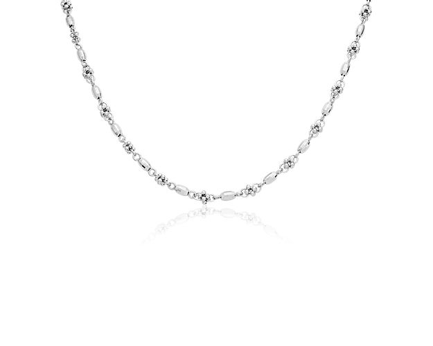 A string of polished faceted 14k Italian white gold beads are interspersed with clusters of small round beads that adds a bit of texture to your look. This necklace is appropriate for everyday wear, and a secure lobster claw clasp means you can wear it with confidence.