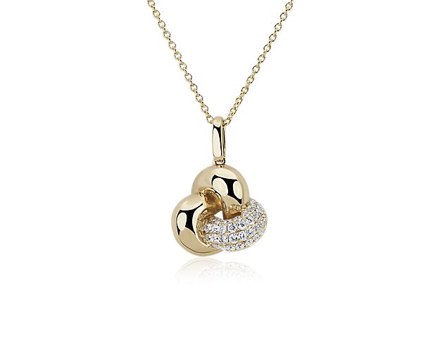 Represent your love in stunning detail with this artfully looping love knot pendant crafted from lustrous 14k yellow gold. Gleaming diamonds accent a curve of the knot with gorgeously sparkling contrast.