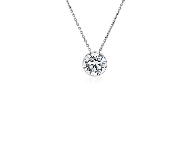 Go for classic allure when you wear this gorgeously simple pendant featuring a graceful floating diamond style setting that maximizes the sparkle of the stone. 14k white gold design delivers lasting quality and beautiful lustre.