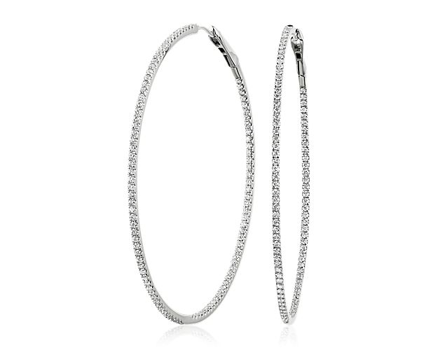 These timeless hoops bring two times the shine thanks to pavé-set diamonds inside and out. Diameter of hoop measures 2 5/16 Inches.