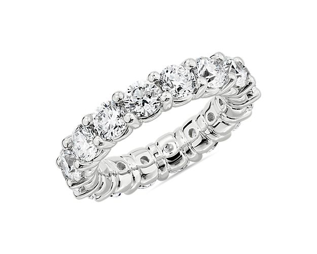 Crafted beautifully from 18k white gold, this eternity ring promises a cool, enduring lustre and a comfortable feel. The band is set with 5 ct. tw. of round-cut diamonds that bring breath-taking sparkle as the light catches them.