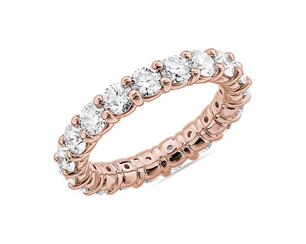 Inspire everlasting romance with this eternity ring crafted from 14k rose gold that boasts a beautifully warm gleam. The 3 ct. tw. of round-cut diamonds encircling the band promises gorgeous sparkle that takes the breath away.