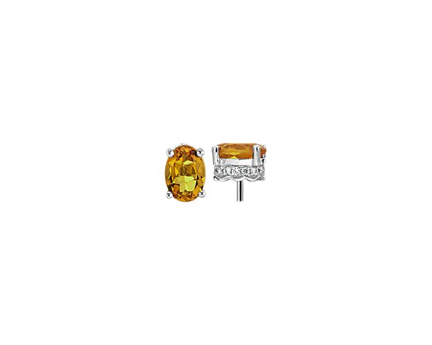 Two vibrant citrine gemstones are set in 14k white gold accented with pavé diamonds. The perfect set of earrings for any ensemble.