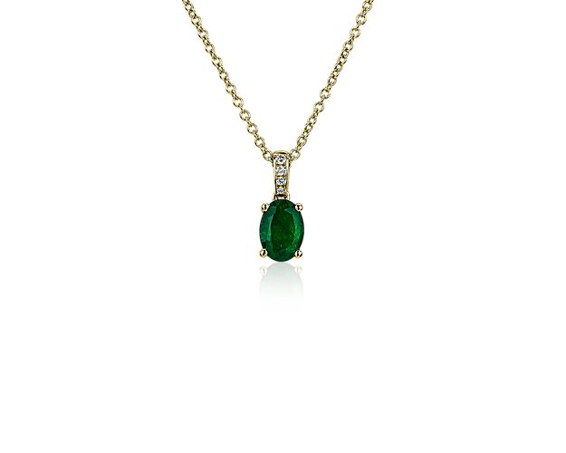 A four-prong yellow gold setting gracefully holds a verdant oval emerald in this timeless pendant. Shimmering pavé-set diamonds adorn the bail, adding eye-catching sparkle. The graceful cable chain is crafted from coordinating yellow gold.