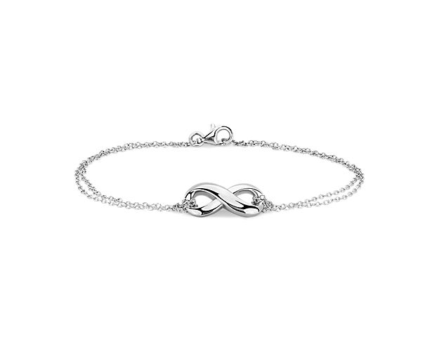 Simple and symbolic, this infinity chain bracelet is crafted in sterling silver. It features a polished infinity charm secured by a double-strand cable chain and secure lobster claw clasp, perfect for everyday wear.