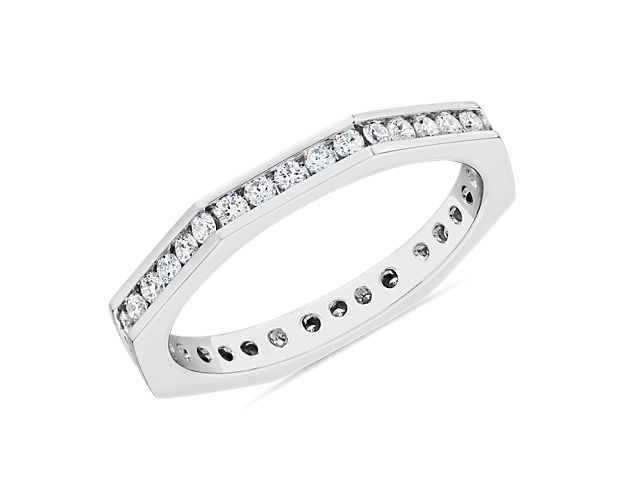 Let your love shine with this gorgeous Zac Posen eternity band crafted from gleaming 14k white gold. Floating diamonds set along the beautifully angled edge give it stunning sparkle.