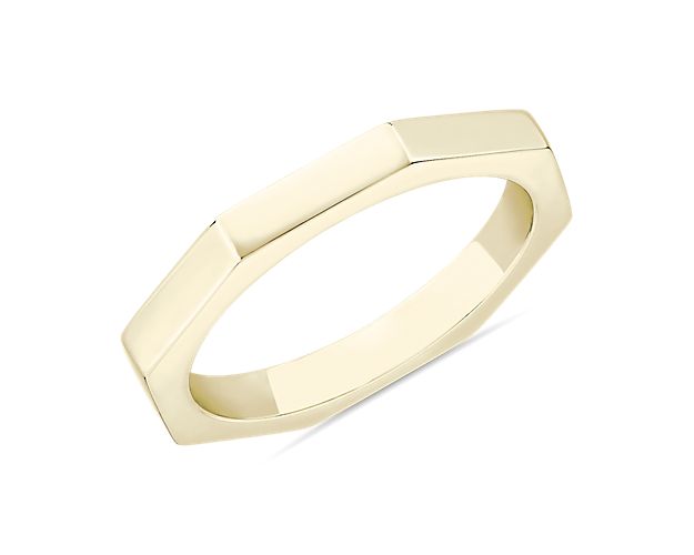 Commemorate your special day with this gorgeously simple wedding band featuring sleek geometric design. The 14k yellow gold design gives the angled sides an eye-catching luster.