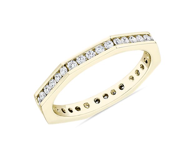 Let your love shine with this gorgeous Zac Posen eternity band crafted from gleaming 14k yellow gold. Floating diamonds set along the beautifully angled edge give it stunning sparkle.