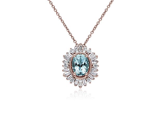 Catch their eye when you wear this gorgeous pendant set with a stunning aquamarine stone featuring an alluring soft blue hue. Delicate baguette-cut diamonds fan in a sparkling halo around the main stone.