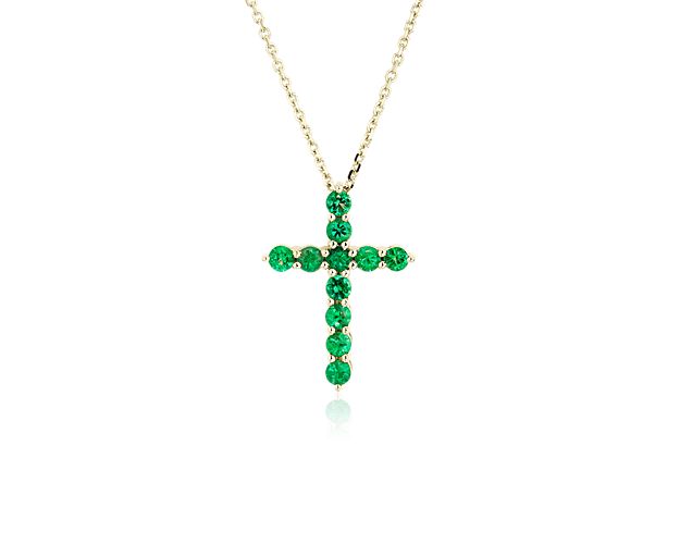 Spectacular green emeralds bring gorgeous color and sparkle to this classic cross-shaped pendant. The setting is crafted from beautifully warm 14k yellow gold that complements the rich colors of the stones.