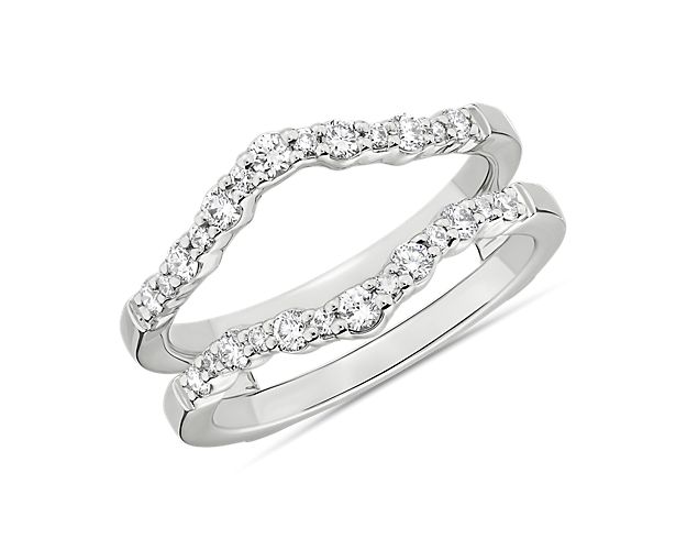 Make your engagement ring sing with sparkle while keeping it protected from dings with 14k white gold diamond guard bands that curve with diamond-trimmed mirrored arches for seamless stacking. Please work with our team to ensure your engagement ring fits perfectly in this guard.